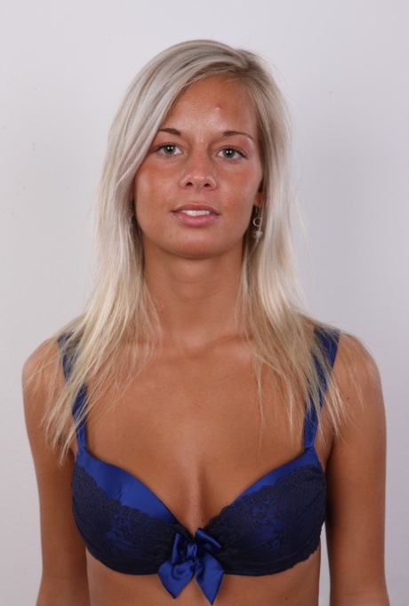 Skinny blonde amateur Adela sheds her underwear to show her small tits and ass