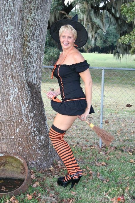 Older lady Tracy Lick shows her bald twat while riding broomstick in backyard
