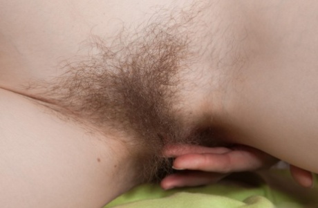 Slender horny mature Alise spreads her hairy beaver for closeup inspection