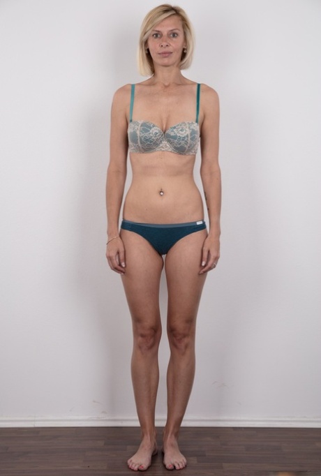 Freckle faced Zaneta takes off her short dress to reveal her slender naked bod