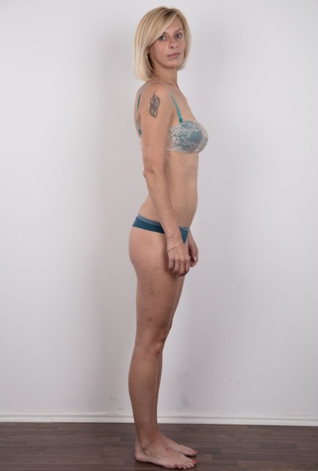 Freckle faced Zaneta takes off her short dress to reveal her slender naked bod