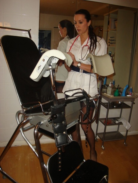 Mature nurse Nylon Jane exposes her upskirt panties on a vintage medical chair