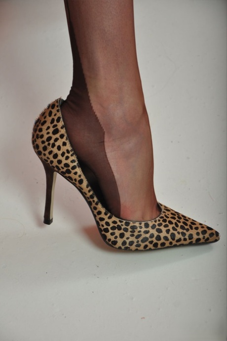 Hot older lady Nylon Jane frees nylon clad feet from animal print pumps