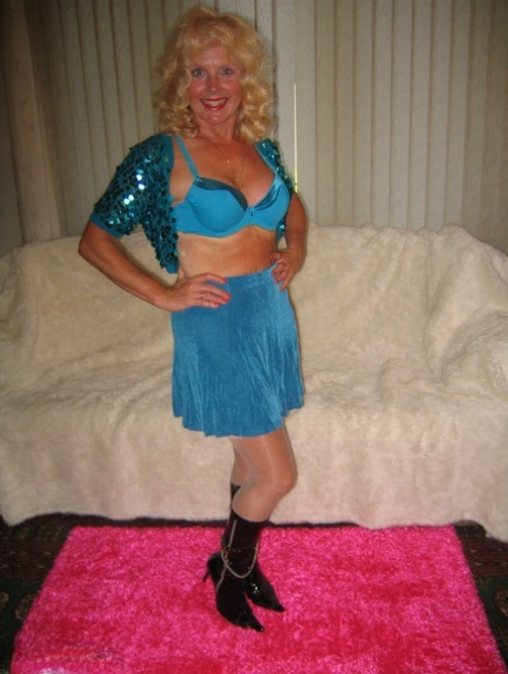 Older blonde Ruth strips to her pretties and black boots before sucking a dick