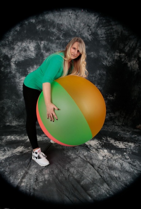 Blonde amateur Sweet Susi gets totally naked on top of a bouncy ball