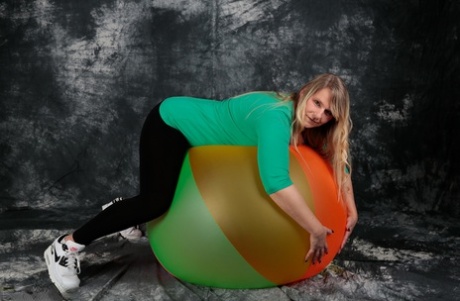 Blonde amateur Sweet Susi gets totally naked on top of a bouncy ball