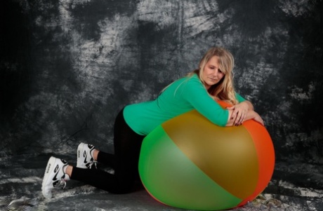 Blonde amateur Sweet Susi gets totally naked on top of a bouncy ball