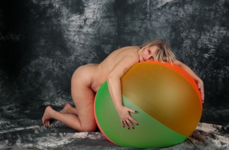 Blonde amateur Sweet Susi gets totally naked on top of a bouncy ball