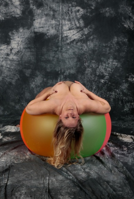 Blonde amateur Sweet Susi gets totally naked on top of a bouncy ball