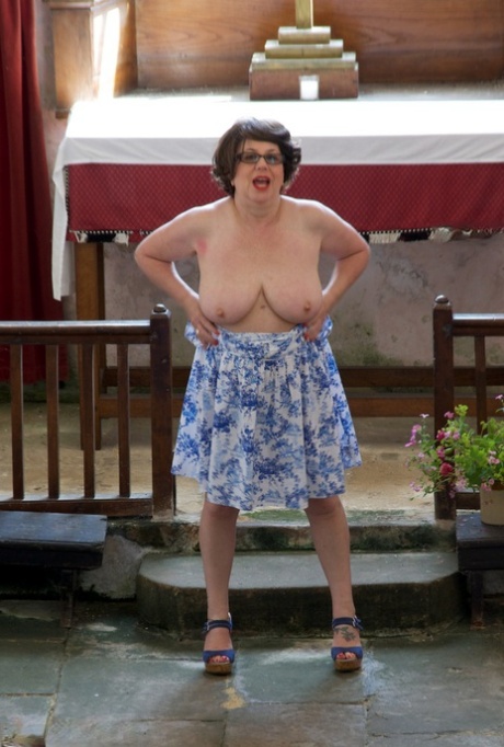 Older UK amateur Speedy Bee gets naked in footwear while in a church
