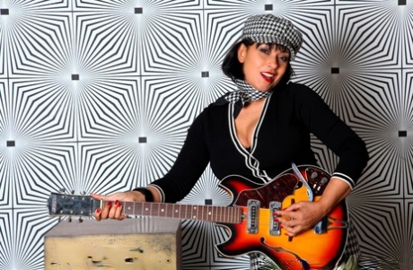 British chick Danica Collins shows her big boobs and twat after playing guitar