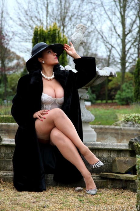 Classy mature woman Danica Collins frees big tits and butt from fur coat