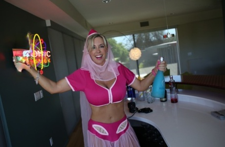 Cute blonde housewife releases her hooters from Jeanie outfit