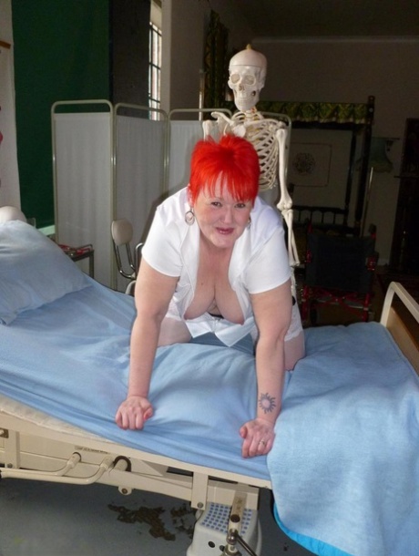Older redhead nurse Valgasmic Exposed gets banged by a dildo wielding skeleton