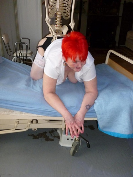 Older redhead nurse Valgasmic Exposed gets banged by a dildo wielding skeleton