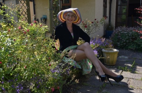 Older blonde Barby Slut gets naked in heels at a country house