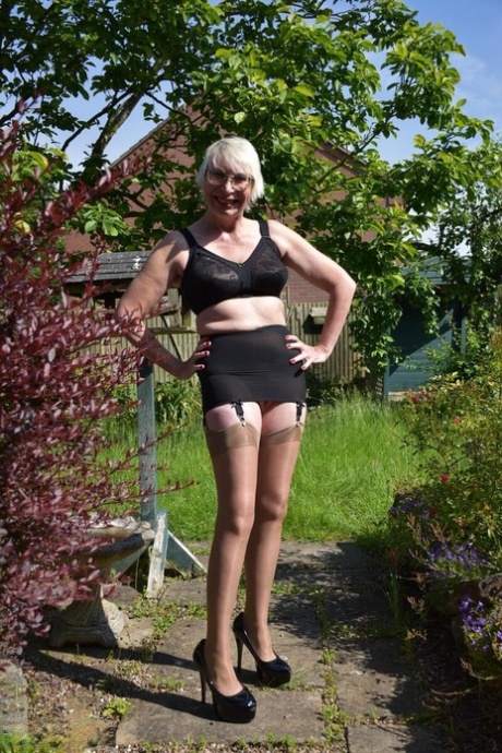 Older blonde Barby Slut gets naked in heels at a country house