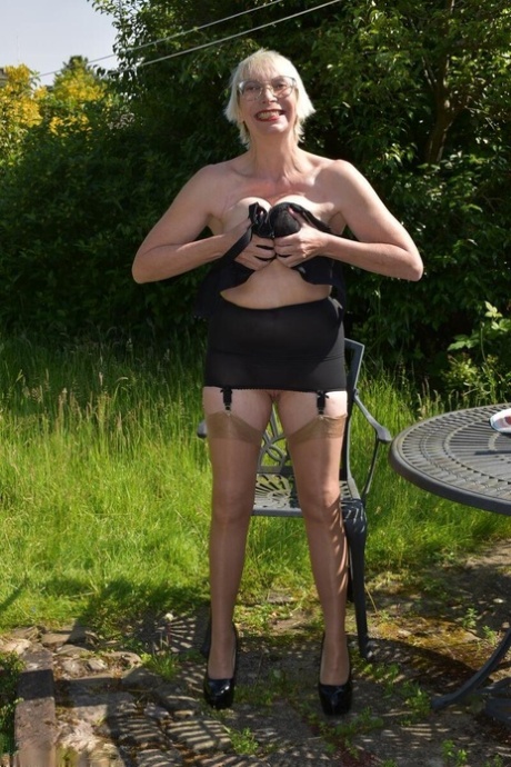 Older blonde Barby Slut gets naked in heels at a country house