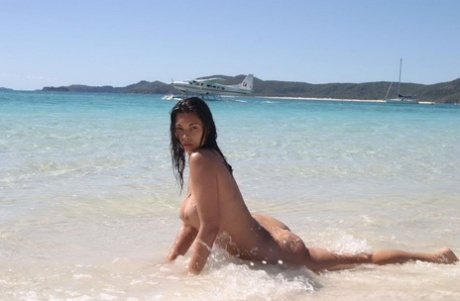Big breasted Tera Patrick tanning her naked hot body on the beach