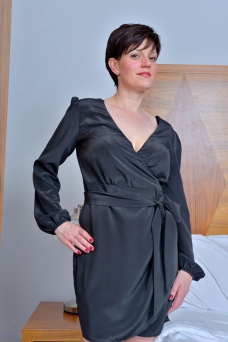Short haired housewife from Britain slips off robe and lingerie to pose naked