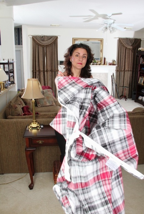 Old woman Gianna Jones is taking off her clothes and plays with puss