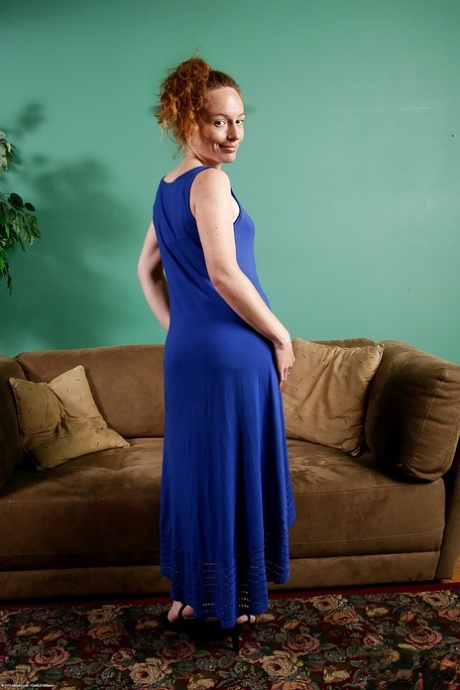 Older redhead lady Ana Molly posing with pubic hairs exposed under panties