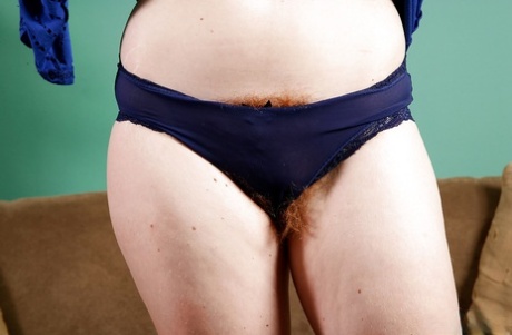 Older redhead lady Ana Molly posing with pubic hairs exposed under panties
