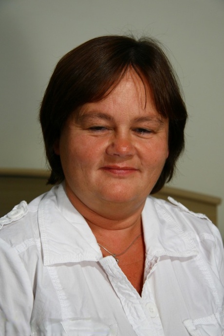 Chubby amateur nurse Tineke K strips and shows her big ass & tits
