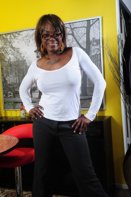 Busty ebony granny Coco Pink gets her clothes off only for your eyes