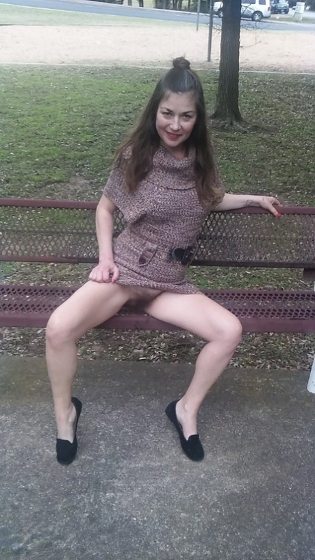 Amateur MILF Olivia Johnson flashing her super hairy pussy in public
