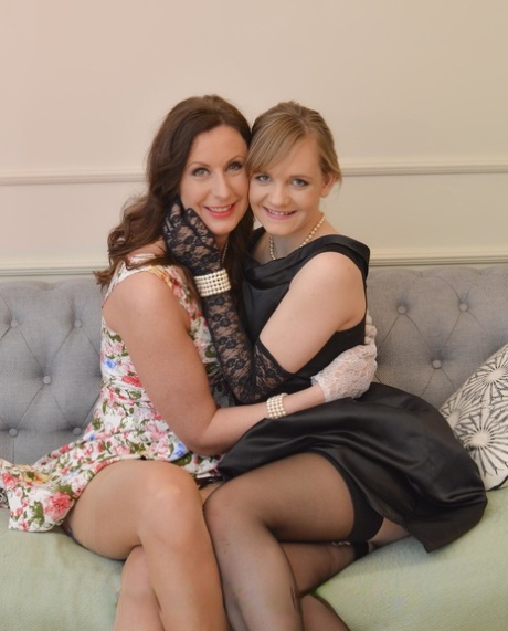 Lady in black lace gloves willingly licks shaved pussy of MILF Lara