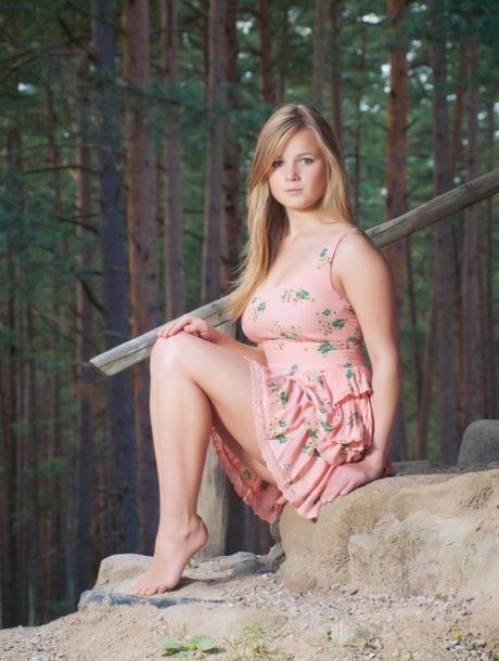 Gorgeous teen babe Sandy C strips outside her cabin & spreads her pussy