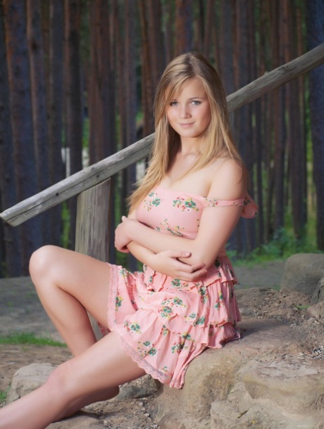Gorgeous teen babe Sandy C strips outside her cabin & spreads her pussy