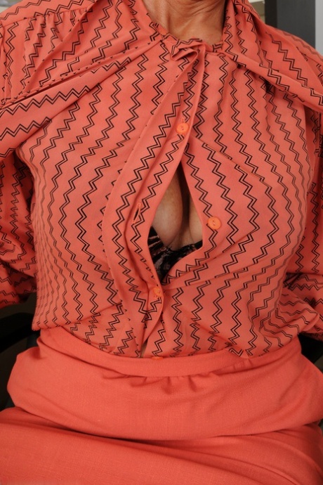 Mature secretary Pam unveils her trimmed pussy and slender body at work