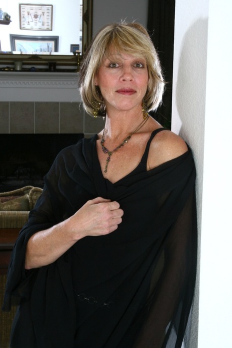 Blonde mature with tiny tits Maya D unveils her fuck hole at her home