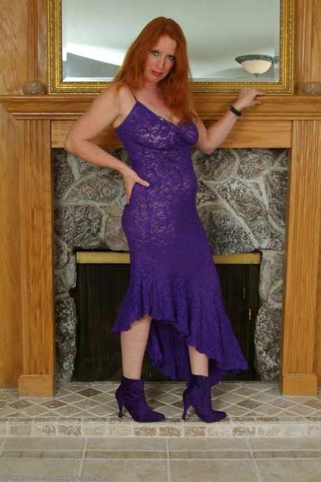 Redheaded mature woman Rose rubs her hairy pussy & licks her big tits