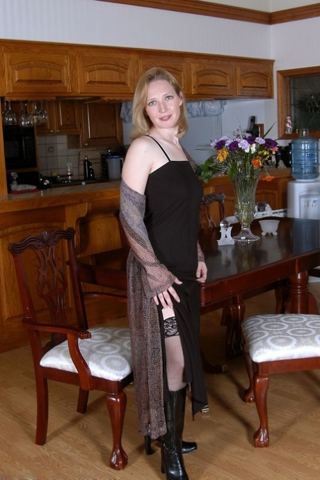Hot MILF Carrie shows her lickable pussy & sweet tits in stockings & boots