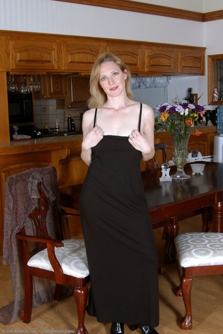 Hot MILF Carrie shows her lickable pussy & sweet tits in stockings & boots