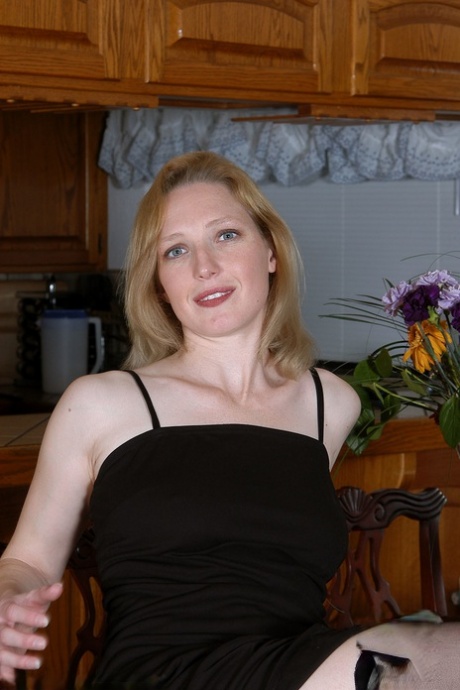 Hot MILF Carrie shows her lickable pussy & sweet tits in stockings & boots