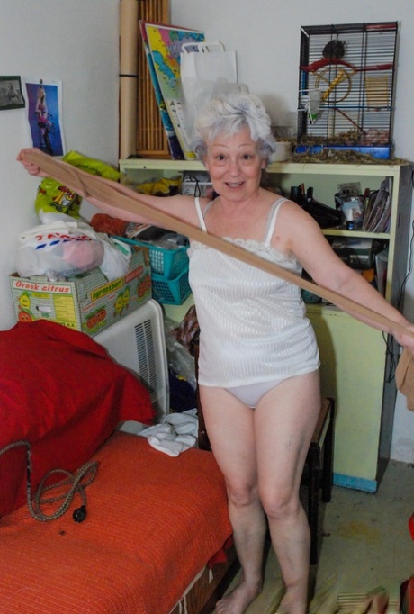 Cock-craving granny Agnes pleasuring her hairy pussy with a dildo