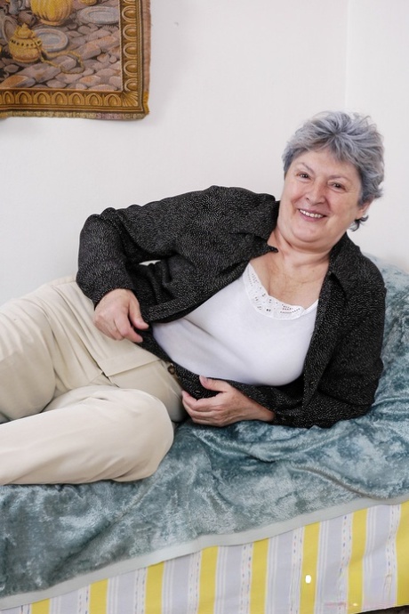 Chubby grey-haired granny Othilia toys her horny hairy pussy with a dildo