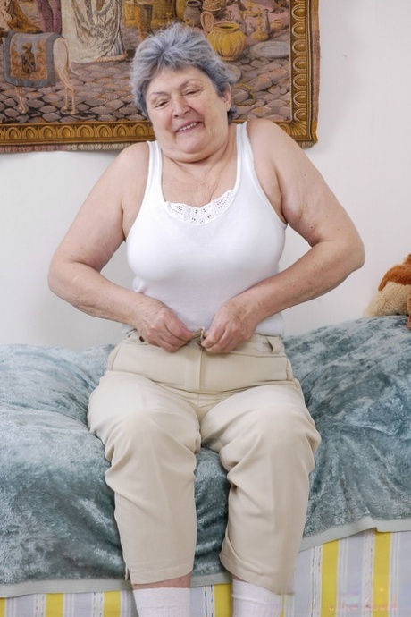 Chubby grey-haired granny Othilia toys her horny hairy pussy with a dildo