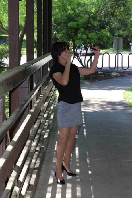 Mature European Carrie M. flashing her hairy vagina through sheer pantyhose