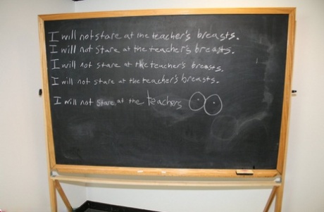 Short-haired teacher Tracy Lick milks a shy student's large dick during class