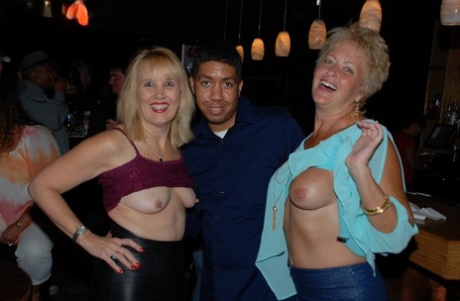 Amateur swinger Tracy Lick and her girls play with horny guys in a night club