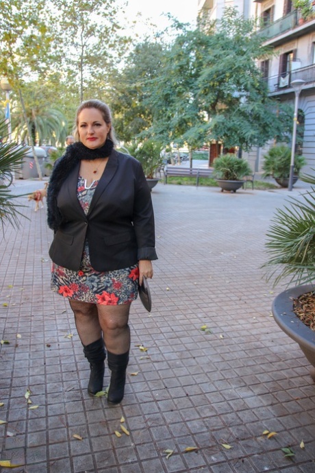 Hot mature BBW Sophia Lola showing her clothed big breasts outdoors