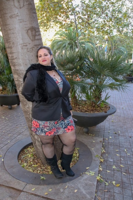 Hot mature BBW Sophia Lola showing her clothed big breasts outdoors