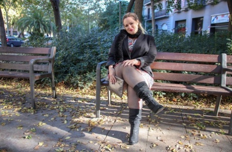 Hot mature BBW Sophia Lola showing her clothed big breasts outdoors