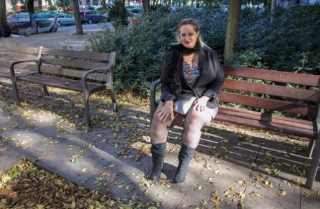 Hot mature BBW Sophia Lola showing her clothed big breasts outdoors