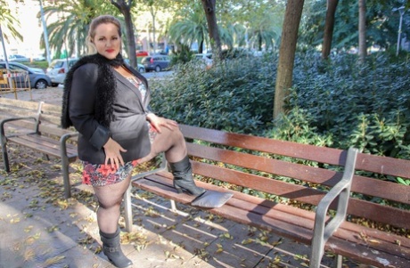 Hot mature BBW Sophia Lola showing her clothed big breasts outdoors